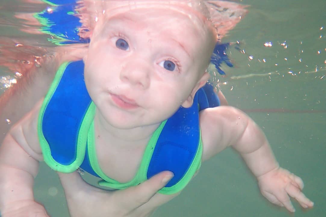 A baby swimming underwater