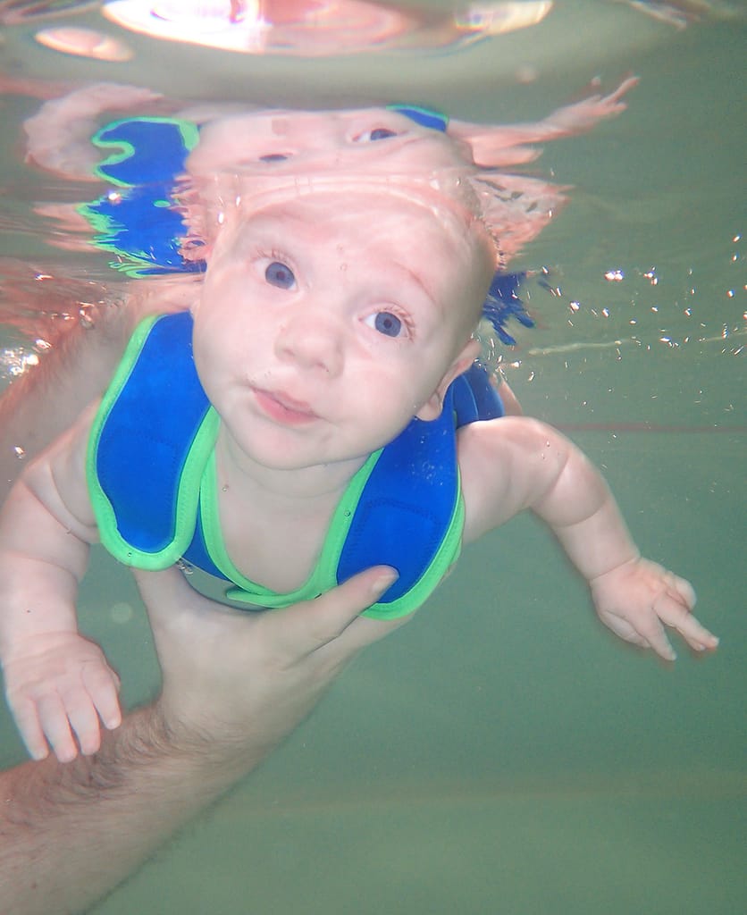 Teaching a baby to swim underwater with their eyes open
